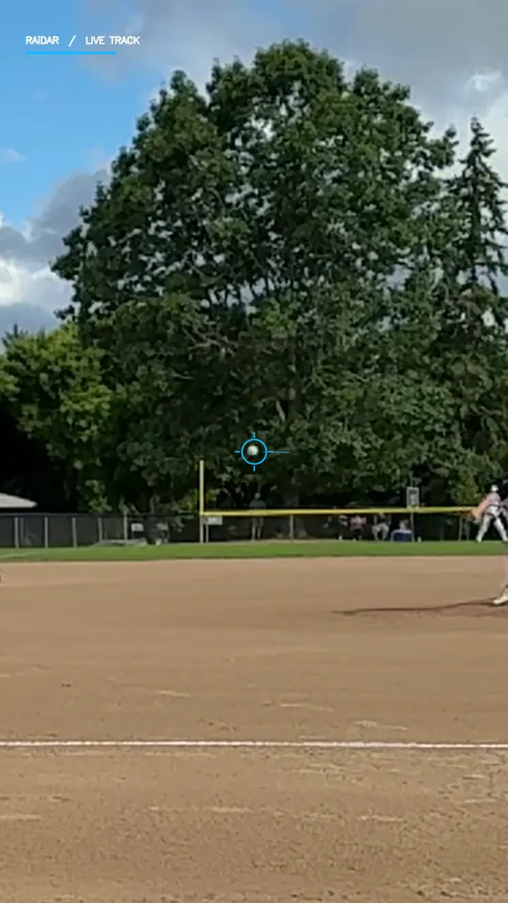 Baseball in flight with a cyan RAiDAR tracking marker